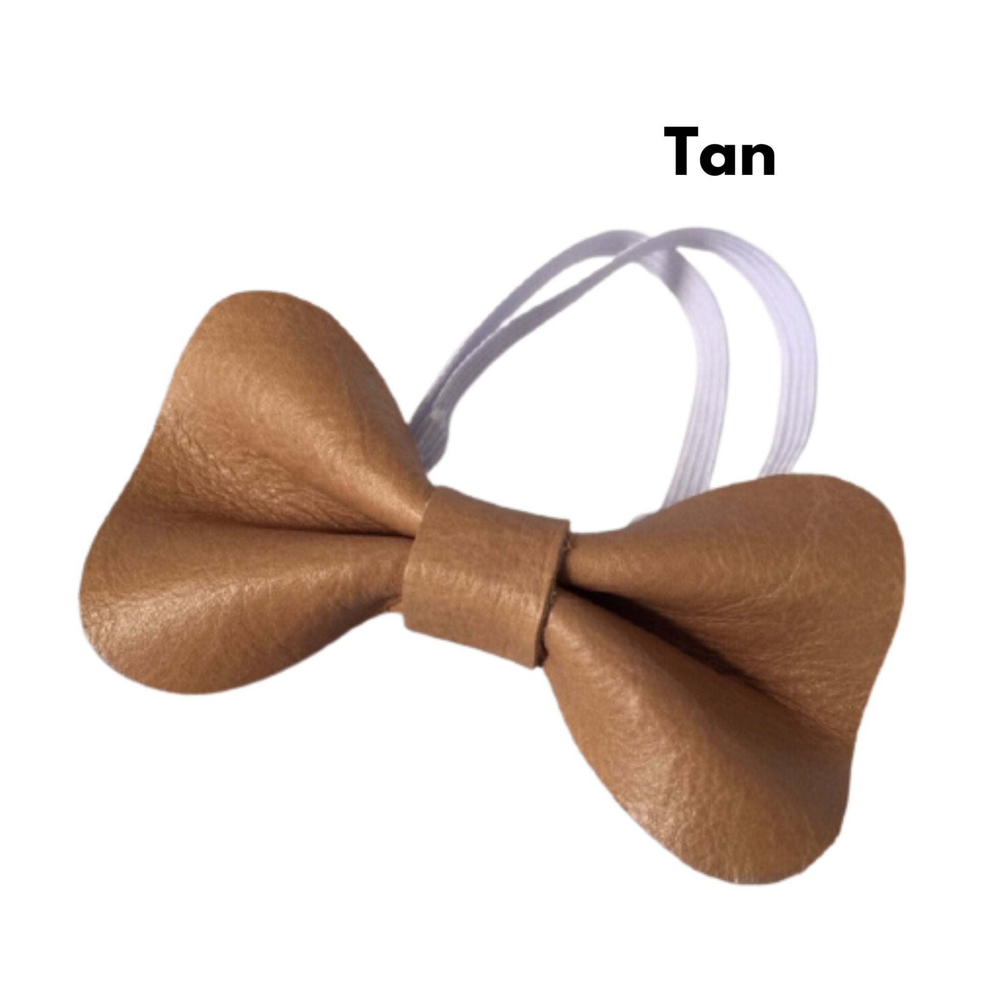 Tan leather bow tie with a white background