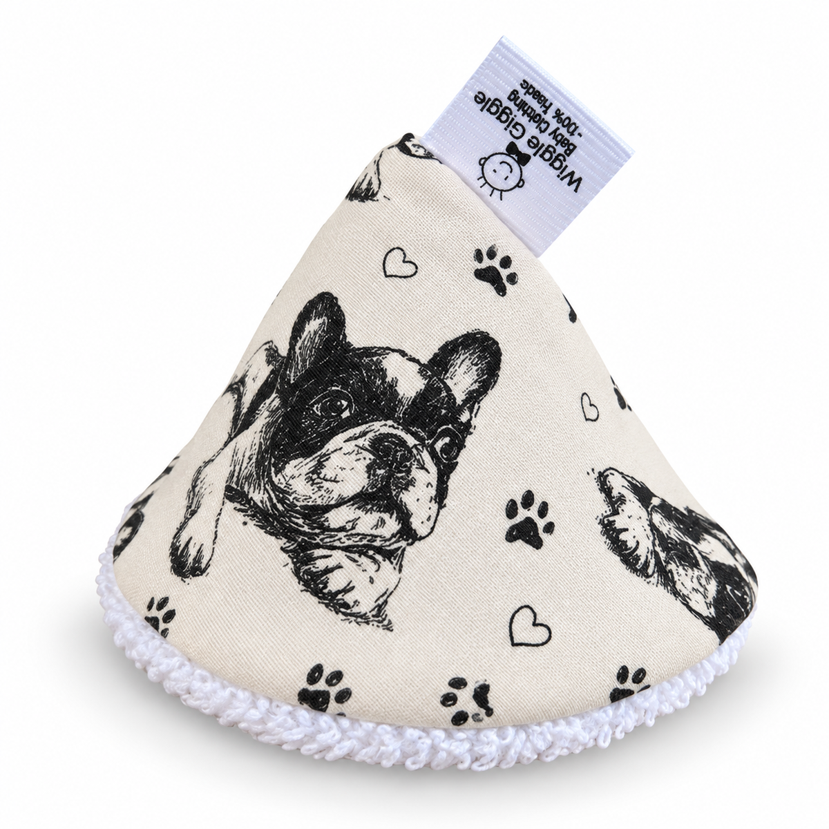 A cone-shaped pee pee teepee made of cream-colored fabric printed with black French Bulldog illustrations, paw prints, and hearts.