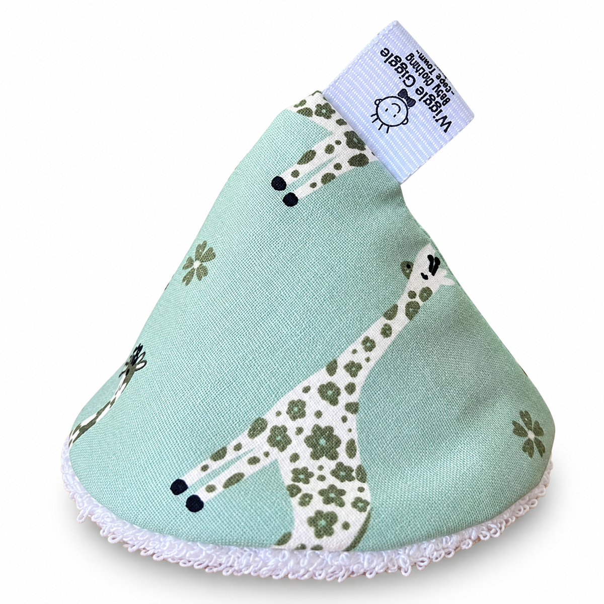 Pee pee teepee with giraffe pattern printed on a light green fabric background